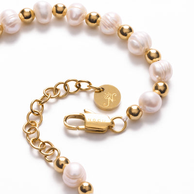 NOGU Pearl Pairings bracelet with lustrous white baroque pearls, polished gold-tone beads, and an adjustable chain clasp.