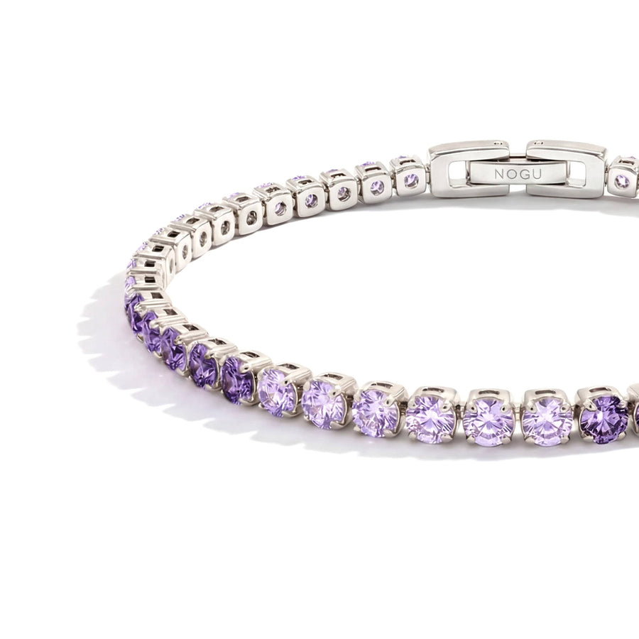 NOGU Tennis Club silver-tone tennis bracelet with delicate lavender purple crystals and a sleek branded clasp.