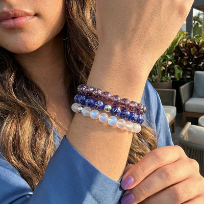 NOGU Made to Pair Purple Elixir bracelet stack with violet, cobalt blue and iridescent beaded bracelets.
