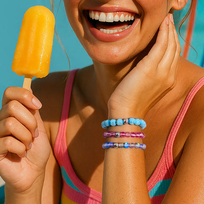 NOGU Popsicle Tones Collection bracelets in bright turquoise, pink, and blue beads with silver accents, styled for summer.