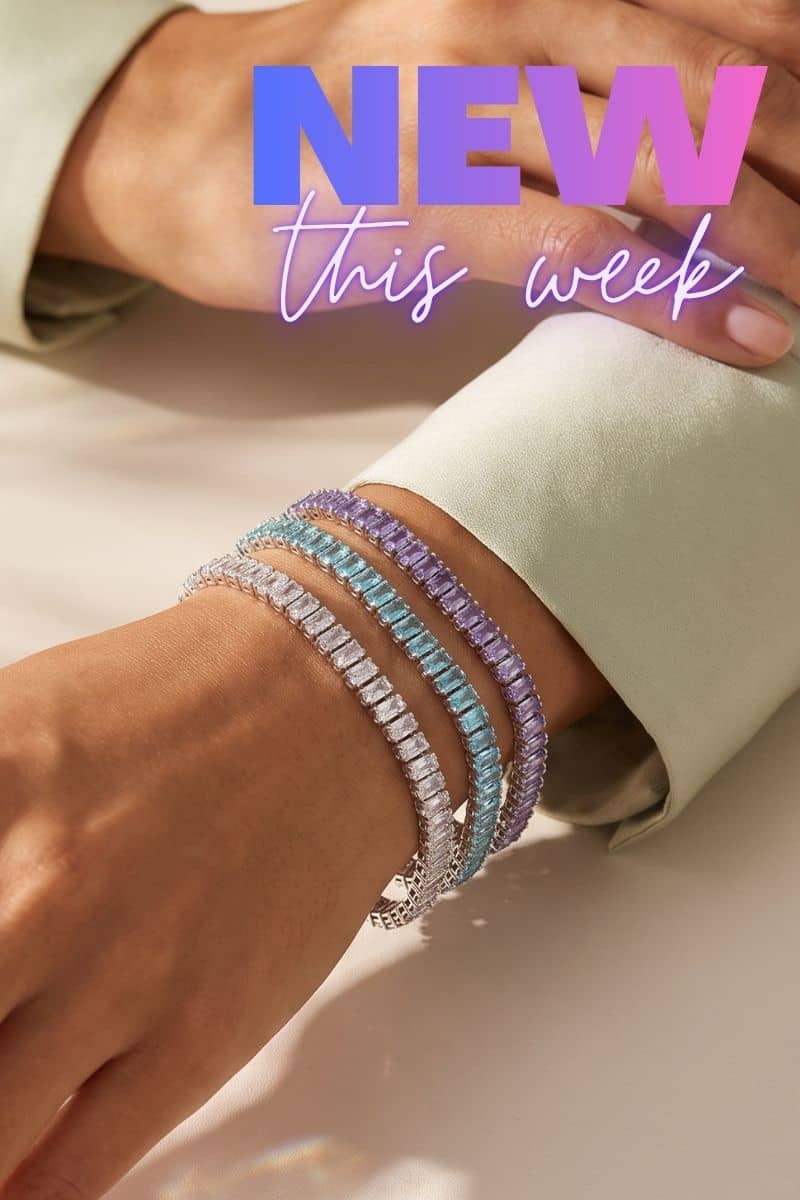 NOGU silver-tone tennis bracelets with pastel lavender, aqua, and clear baguette-cut crystals layered on a wrist.