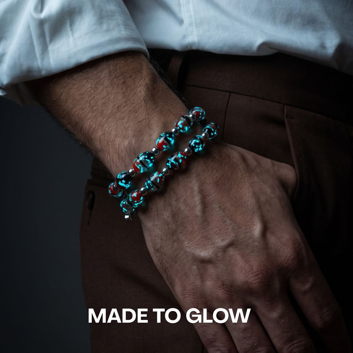 NOGU blue and red translucent beaded bracelet with a bold glossy finish, styled on a wrist.