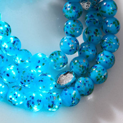Blue Juniper Firefly Glass Bracelet with blue speckled beads and silver clasp close-up by NOGU