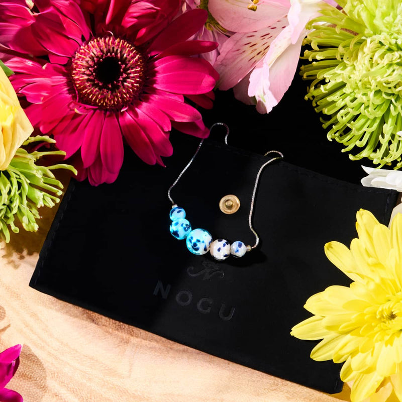 Sternenklare Wellen | 925er Sterlingsilber | Glühwürmchen-Glas-Halskette mit Unendlichkeitsverschluss