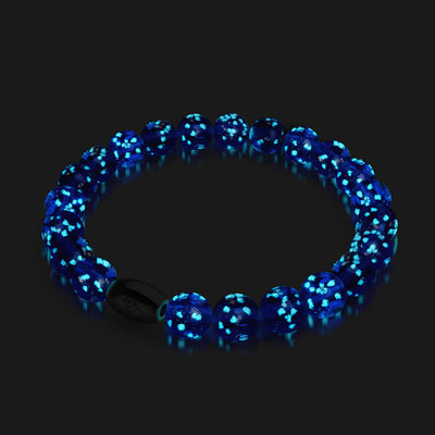 Lapis Lazuli Firefly Glass Bracelet glowing blue beads with .925 sterling silver clasp in dark background by NOGU