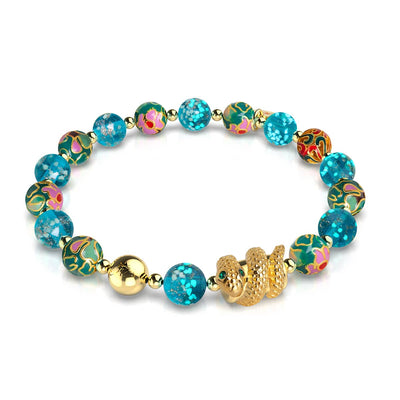 Sea Dragon bracelet with teal firefly glass beads, 18k gold serpent charm, and stainless steel by NOGU