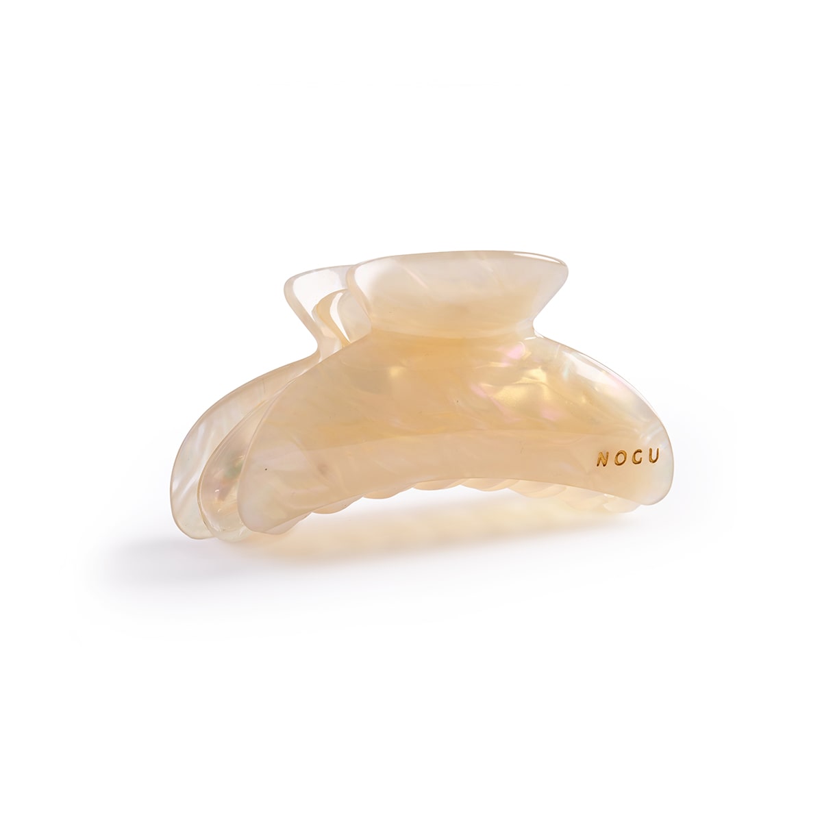 Ivory Mirage cellulose acetate hair claw with pearlescent finish and engraved logo by NOGU