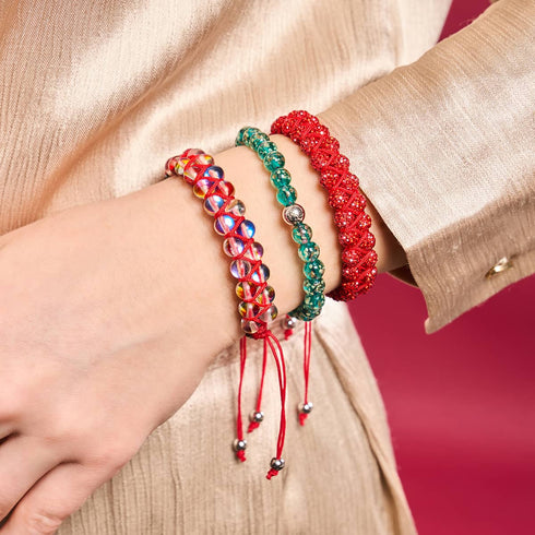 Mini-Armband aus blaugrünem Glühwürmchenglas mit roter Schnur