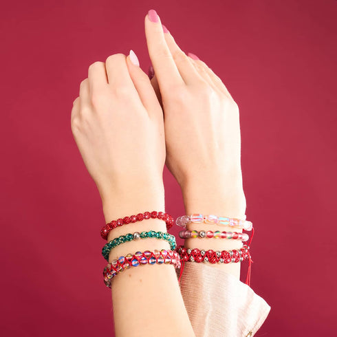 Mini-Armband aus blaugrünem Glühwürmchenglas mit roter Schnur