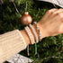 Armband aus goldfarbenem Chrom und weißem Glitzerglas