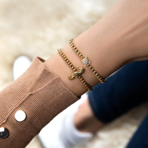 Riff | 18 Karat Gold | Seepferdchen Makramee Charmballa Armband