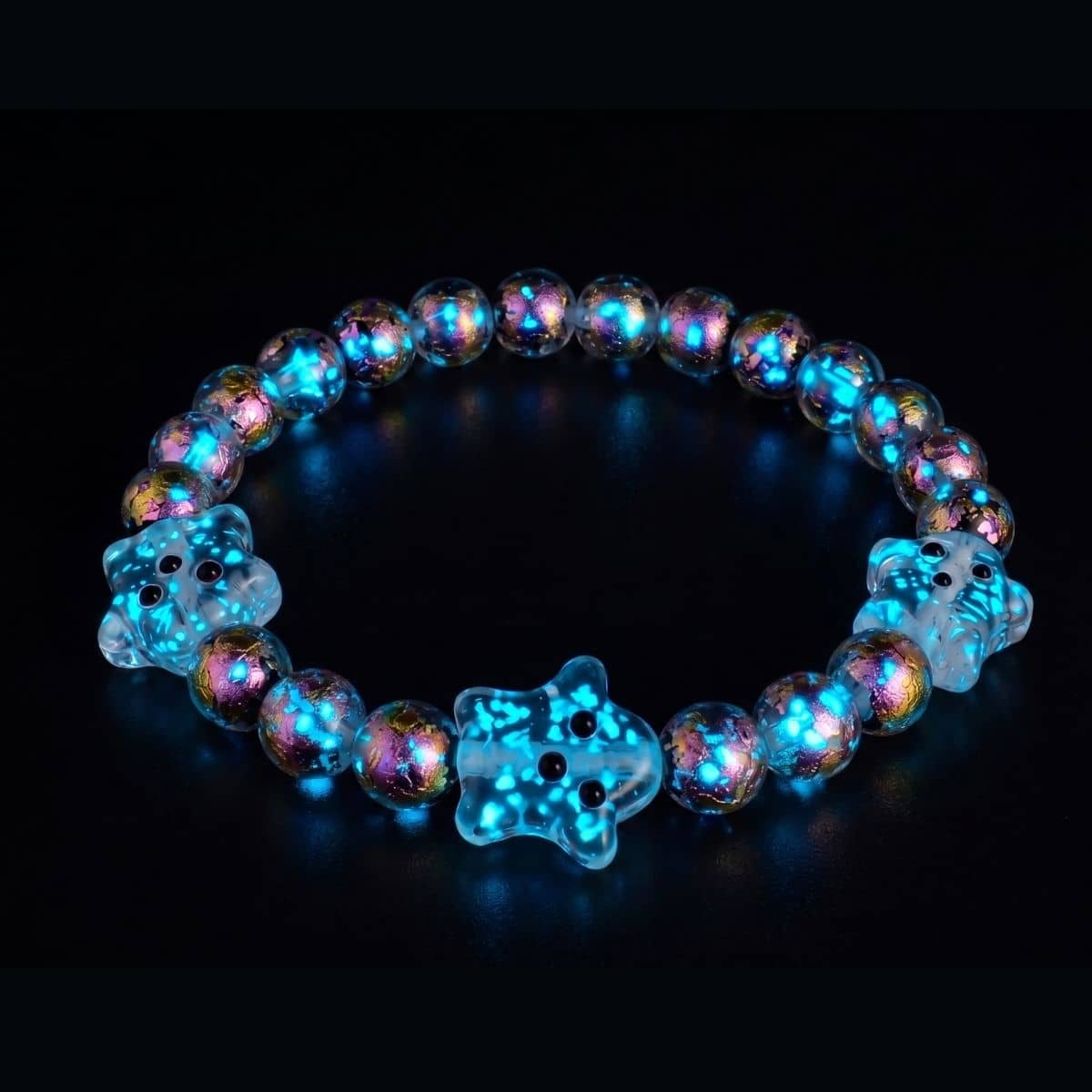 Pink Potion Firework Glass Ghost Bracelet with iridescent pink, turquoise and gold beads and three clear ghost charms