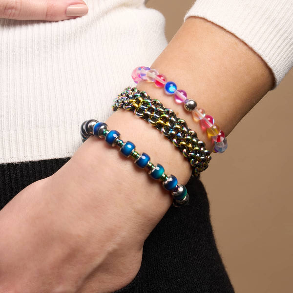 Candy Crush silver galaxy glass bead bracelet with multicolor 6mm beads on wrist alongside two other bracelets by NOGU