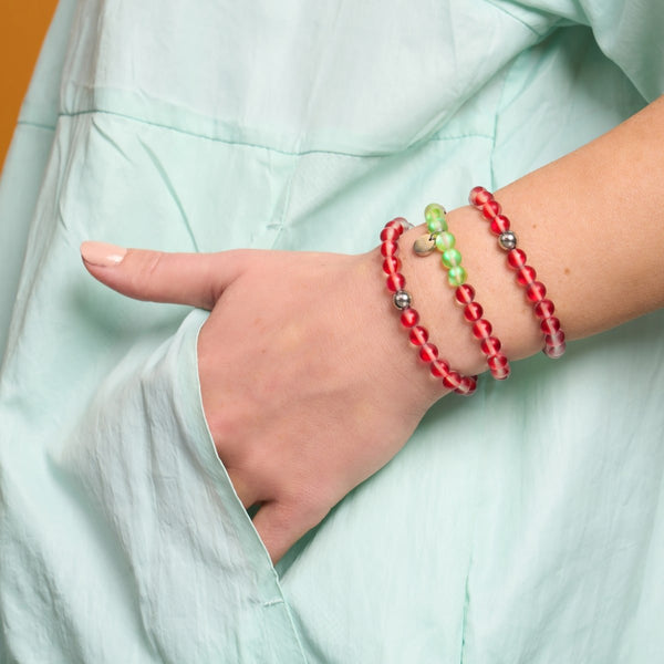 Portugal Mermaid Glass Nations Bracelet worn with two similar beaded bracelets on wrist with light blue sleeve by NOGU